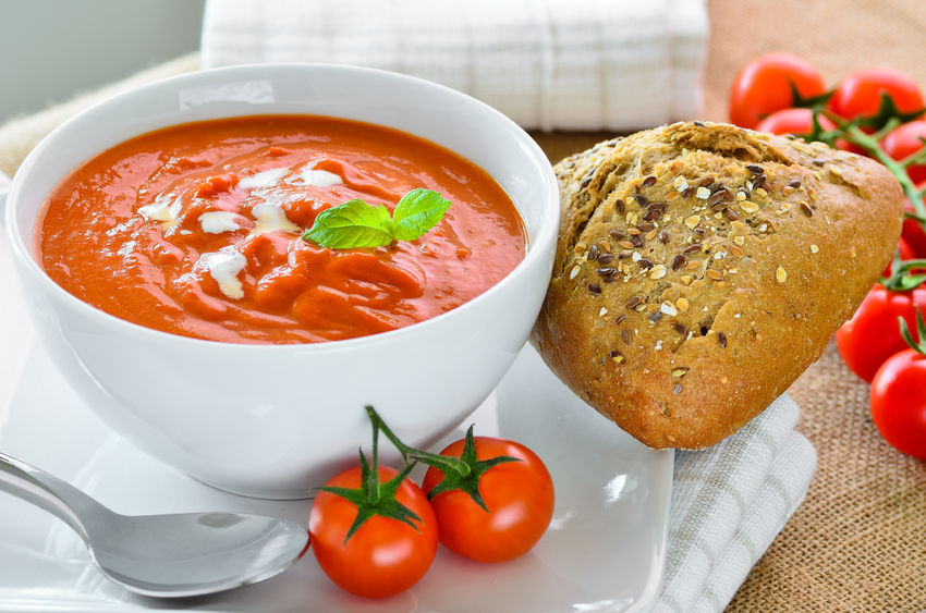 Tomato soup with crusty bread roll