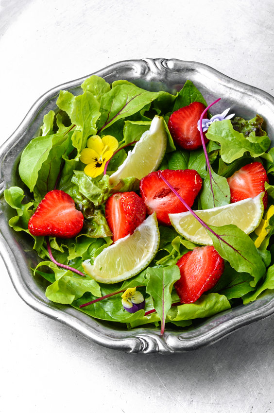Bowl of salad with strawberry